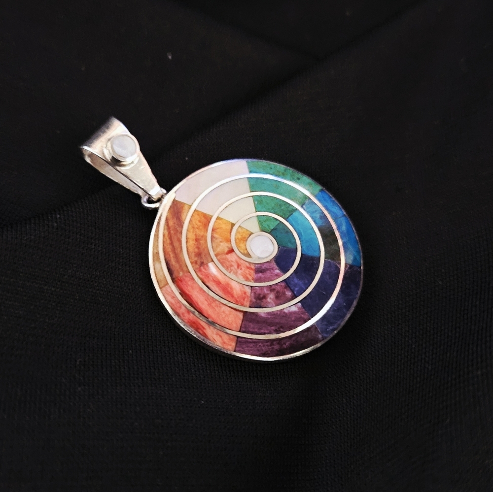 Peruvian 950 silver Pachamama pendant inlaid with semi-precious stones.